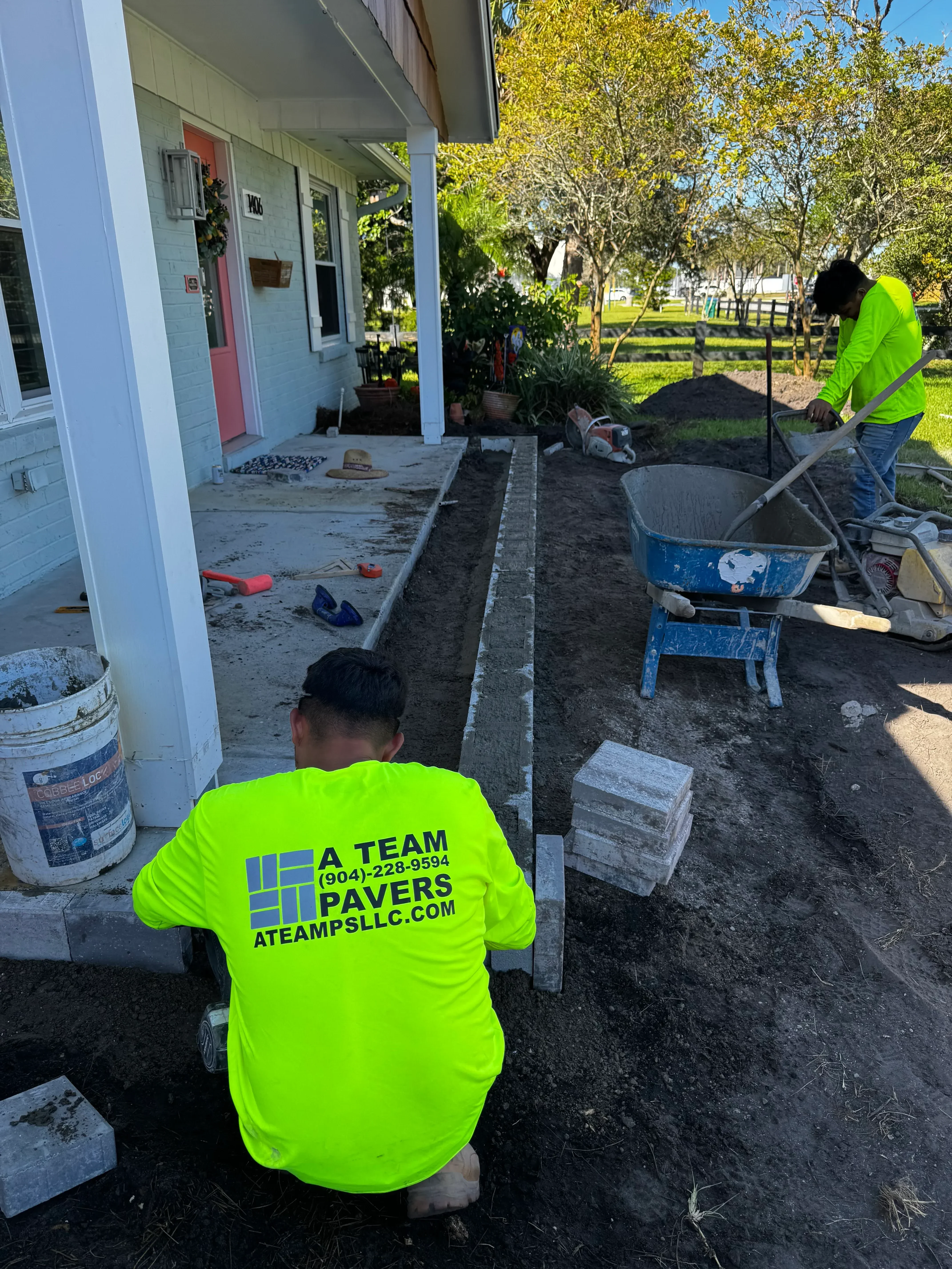 Concrete driveway repair with removed sections, formwork, and base preparation